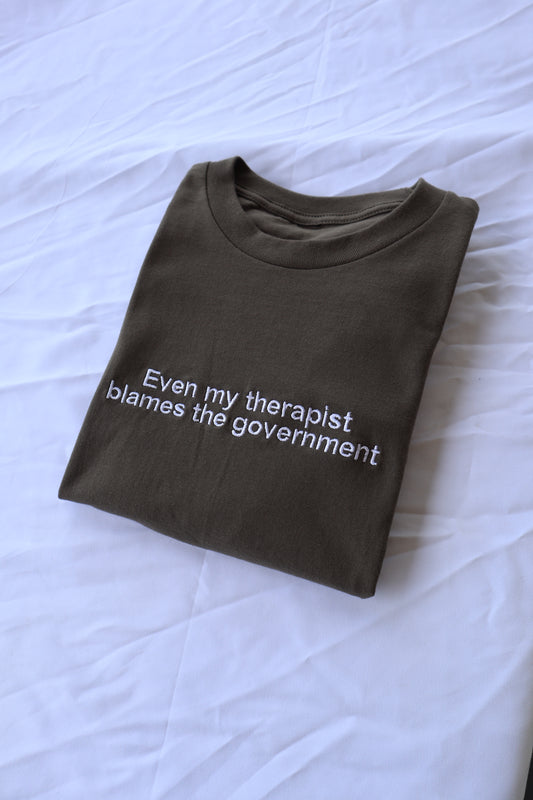 Even my therapist blames the government, Short Sleeve, Modern Classic Fit, Unisex, Adult T-Shirt